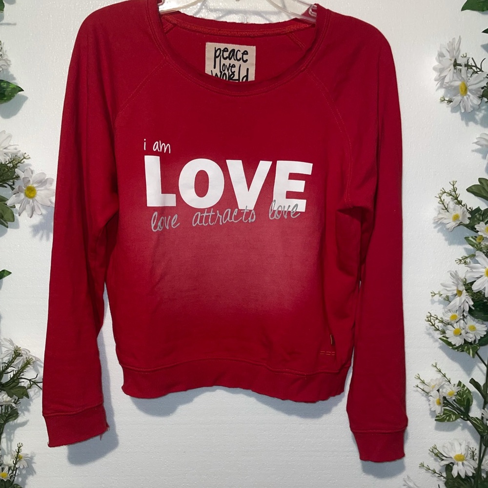 PEACE LOVE WORLD crew sweatshirt.